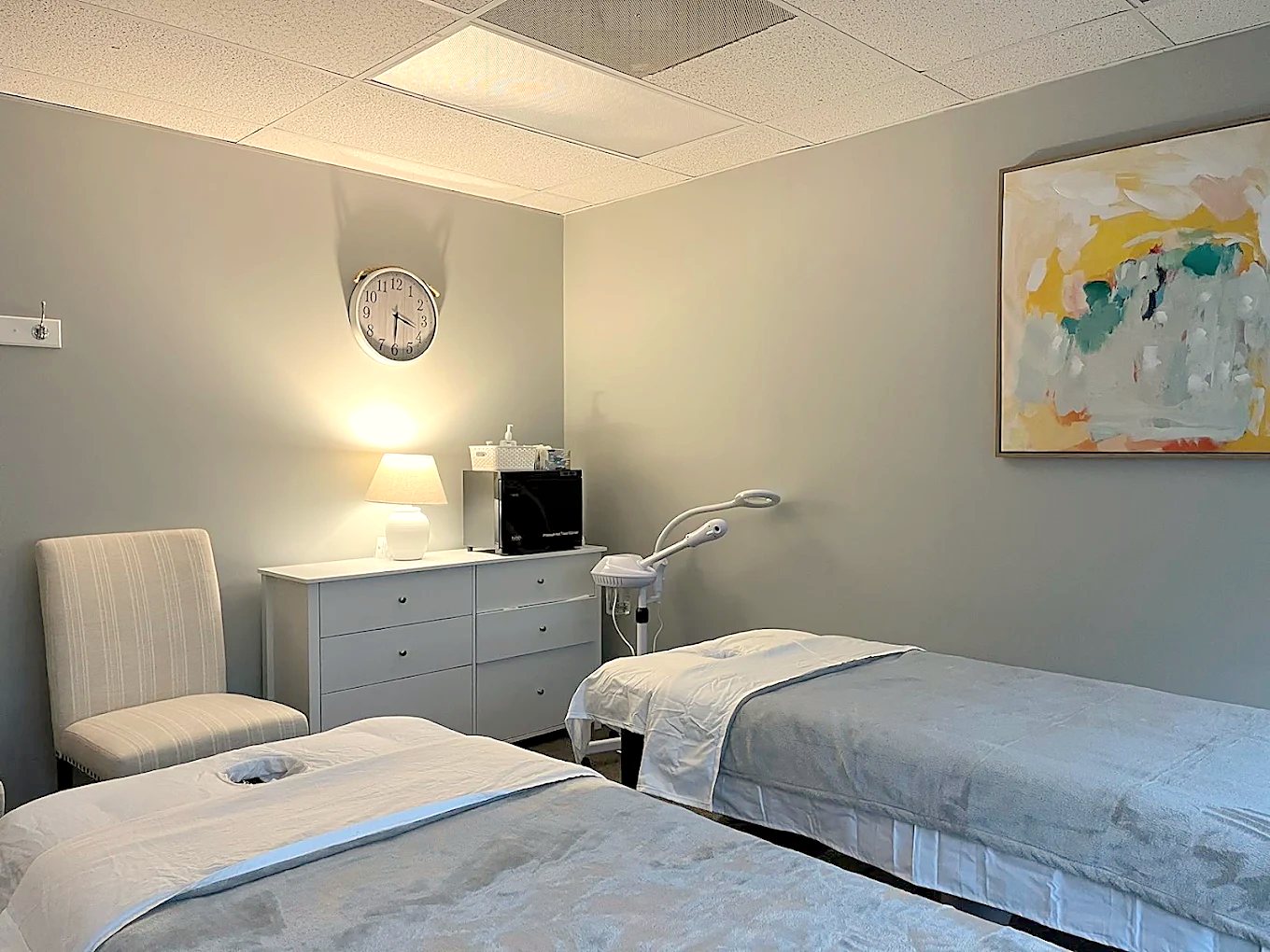 Two-bed massage room with soft lighting at Tea Tree Massage Spa in Herndon, VA