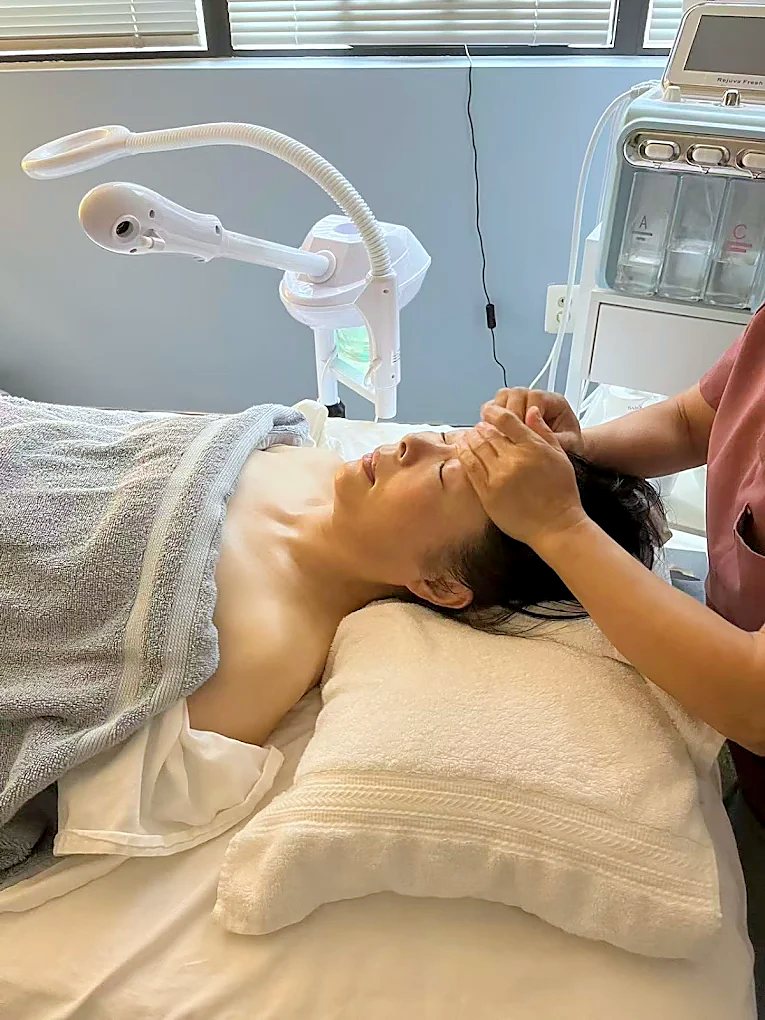 Therapist giving a relaxing head and scalp massage